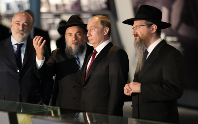 Russian President Vladimir Putin (C) visits the Jewish Museum and Tolerance Center with Russian Chief Rabbi Berel Lazar (R) and Rabbi Alexander Boroda, the president of the Federation of Jewish Communities in Russia and the museum’s director general (L)  in this undated picture.  (Courtesy)