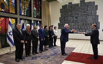 Turkish ambassador to Israel Kemal Okem, right, hands his diplomatic credentials to Israeli President Reuven Rivlin in Jerusalem on December 12, 2016. (AFP/ POOL / RONEN ZVULUN)
