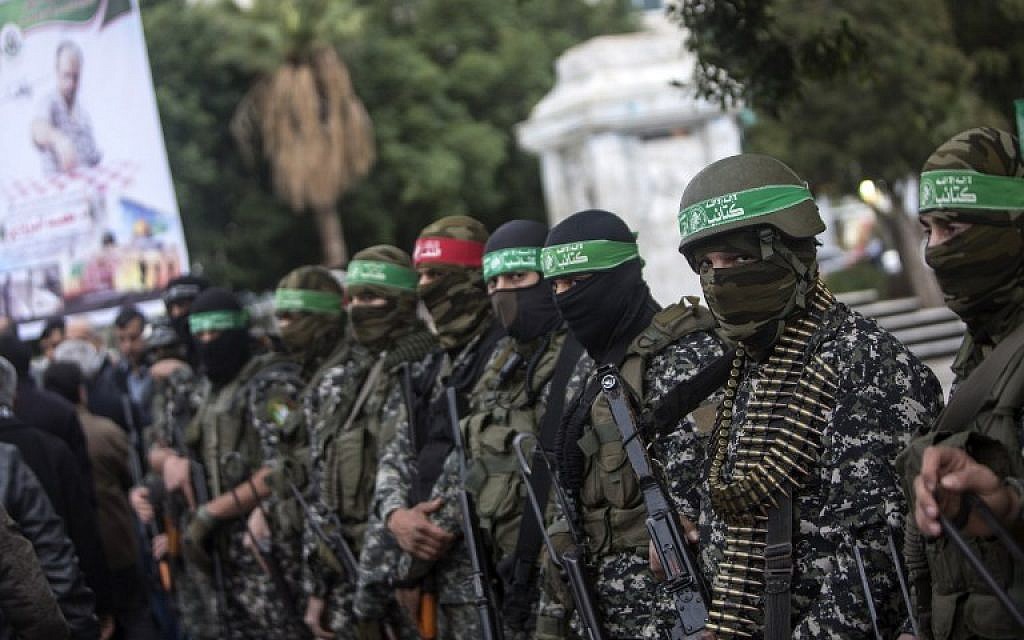 Members of the Izz ad Din al-Qassam Brigades, Hamass military wing, take part in a ceremony, on December 18, 2016, in Gaza City in the memory of one of their leaders, Mohamed Zaouari, who was murdered in Tunisia. (AFP/Mahmud Hams)