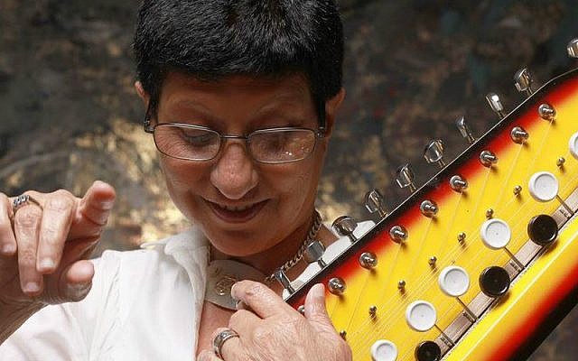 Beloved Israeli singer Ahuva Ozeri, here with her favorite instrument, the Bulbul tarang, died Tuesday, December 13, 2016 (Courtesy Ilan Besor)