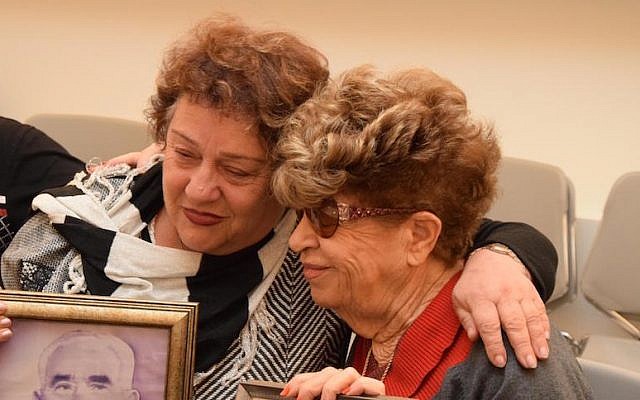 Fania Blakay, left, embracing her cousin Henia Moskowitz after they were united at the Yad Vashem Holocaust museum in Jerusalem, Dec. 13, 2016. (Courtesy of Yad Vashem).