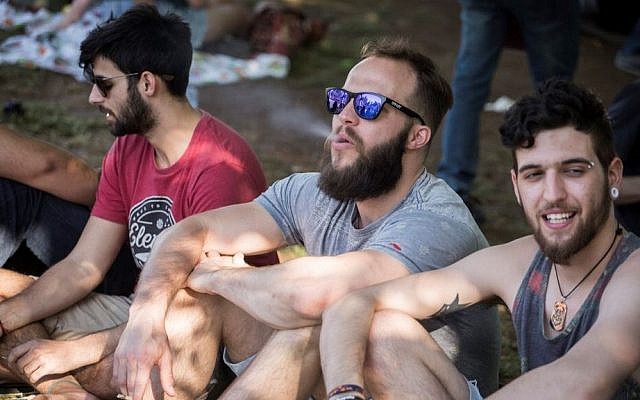 Young Israelis gathered at the Rose Garden in front of the Knesset, to smoke weed, on the international '4:20' marijuana smoking day, in a demonstration to legalize the drug, in Jerusalem, on April 20, 2016. (Hadas Parush/Flash90)