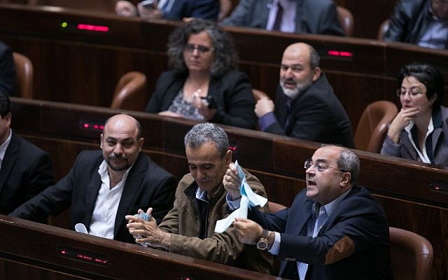 Arab MKs rip up copies of proposed legislation to protest the outpost Regulation Bill in the Knesset on December 5, 2016. Yonatan Sindel/Flash90)