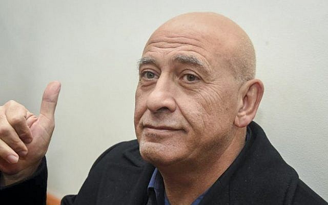 Joint (Arab) List member Basel Ghattas is brought to court for a remand on his arrest at the Rishon Lezion Magistrate's Court, December 27, 2016. (Yair Sagi/POOL)