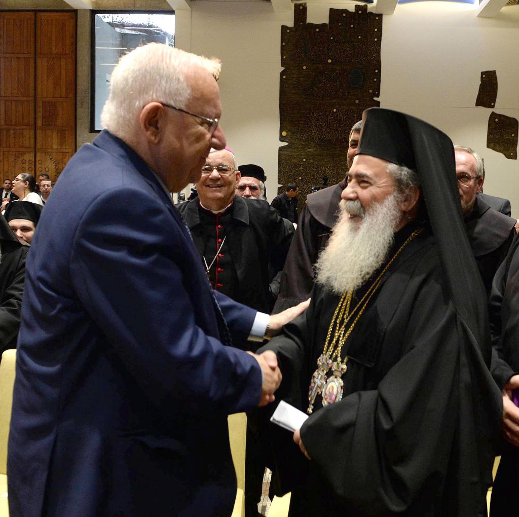 President Reuven Rivlin speaks with Greek Orthodox Patriarch of Jerusalem Theophilos III at his residence in Jerusalem in honor of the upcoming New Year, on December 27, 2016. (Mark Neiman/GPO)