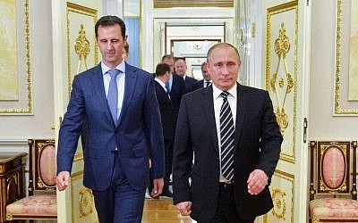 File: Russian President Vladimir Putin, right, and Syria President Bashar Assad arrive for a meeting in the Kremlin in Moscow, Russia, October 20, 2015. (Alexei Druzhinin, RIA-Novosti, Kremlin Pool Photo via AP, File)