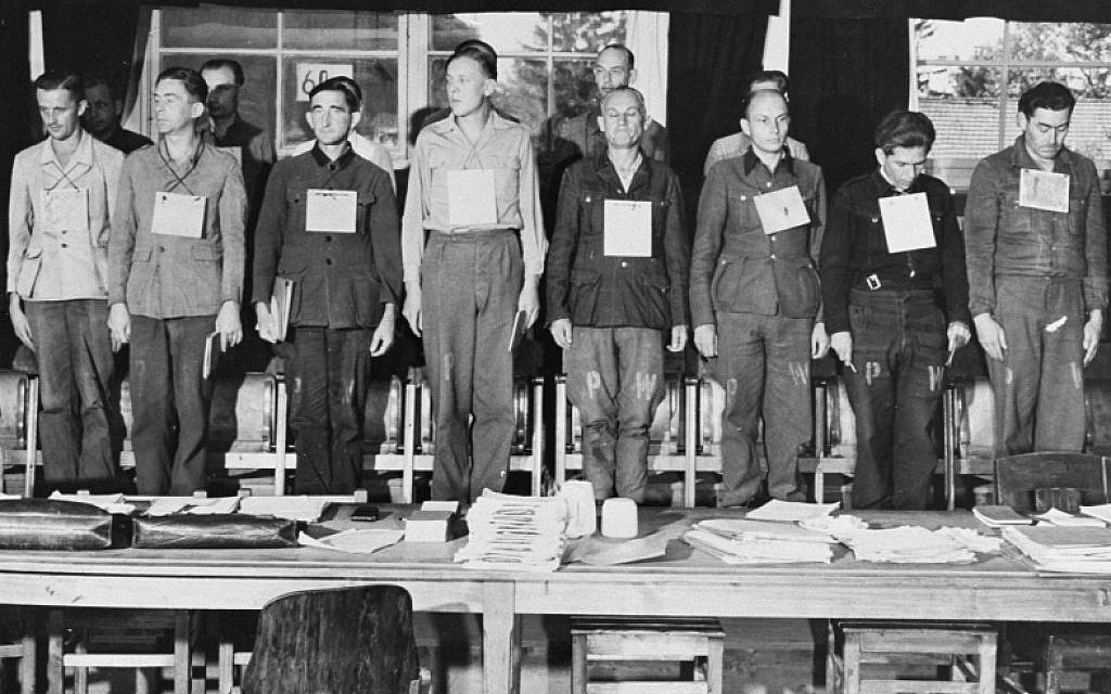 Sixteen of nineteen defendants on trial for war crimes committed during the war at Dora-Mittelbau. The group included four Kapos. September 17, 1947, Dachau, Germany (US Holocaust Memorial Museum, courtesy of National Archives and Records Administration, College Park)