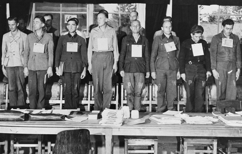 Sixteen of the nineteen defendants on trial for war crimes committed during the war at Dora-Mittelbau. The group included four Kapos. September 17, 1947, Dachau, Germany (US Holocaust Memorial Museum, courtesy of National Archives and Records Administration, College Park)