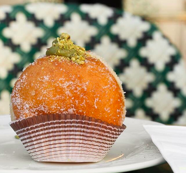 A Kadosh pistachio cream sufganiya, one of 50 flavors being made over the course of the eight-day holiday (Courtesy Kadosh)