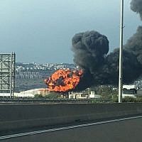 Illustrative: A blaze and toxic smoke clouds at the Bazan Group's Haifa oil refinery on December 25, 2016. (Israel Police)