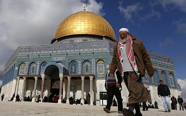 A Palestinian man walks past the Dome of Rock at the Al-Aqsa Mosque compound before the Friday prayer in Jerusalem's Old City on January 13, 2017. (AFP/Ahmad Gharabli)