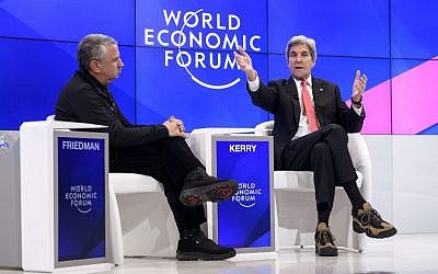 Outgoing US Secretary of State John Kerry (R) gestures as he speaks on the opening day of the World Economic Forum, on January 17, 2017, in Davos. The global elite begin a week of earnest debate and Alpine partying in the Swiss ski resort of Davos on January 17, 2017 in a week bookended by two presidential speeches of historic import. (AFP PHOTO / FABRICE COFFRINI)