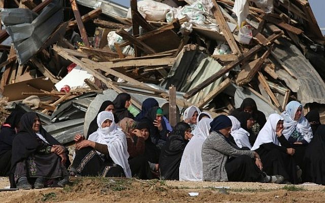 Bedouin women react to the destruction of houses on January 18, 2017, in the unrecognized Bedouin village of Umm al-Hiran in the Negev desert. (AFP Photo/Menahem Kahana)