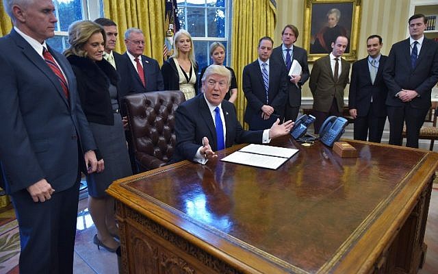 US President Donald Trump speaks before a signing ceremony for executive orders and memorandums in the Oval Office of the White House on January 28, 2017, in Washington, DC. (AFP PHOTO / MANDEL NGAN)