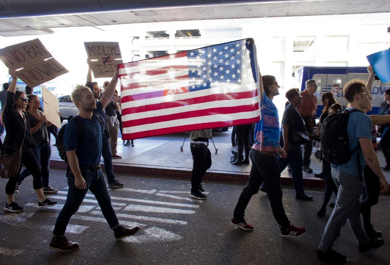 Protesters gather at the Los Angeles International airport's Tom Bradley terminal to demonstrate against President Trump's executive order effectively banning citizens from seven Muslim majority countries. (AFP PHOTO / Konrad Fiedler)