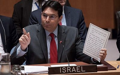 Danny Danon holds a paper showing a Jewish 1928 commitment not to infringe on Muslim rights at their holy sites. (Kim Haughton)