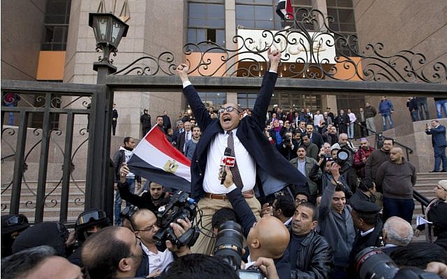 Lawyer and former presidential candidate Khaled Ali, center, celebrates with others after the Supreme Administrative Court said two islands, Sanafir and Tiran, are Egyptian, debunking the government's claim that they were Saudi, in Cairo, Egypt, Monday, January 16, 2017. (AP/Amr Nabil)