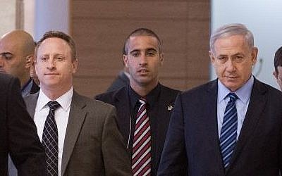 Prime Minister Benjamin Netanyahu, right and his then-chief of staff Ari Harow arrive at a Likud faction meeting in the Knesset, November 24, 2014. (Miriam Alster/Flash90)