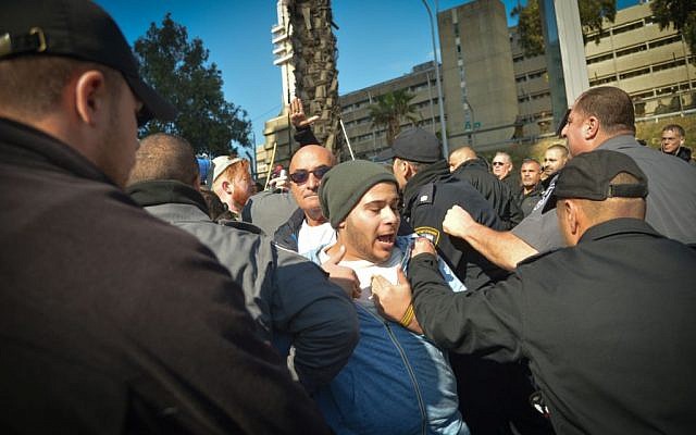 Following the conviction at of IDF Sgt. Elor Azaria for the manslaughter of a Palestinian attacker, police detain a demonstrator during a protest in support of the soldier, outside the courtroom in the Kirya military base, Tel Aviv, January 4, 2017. (Flash90) 