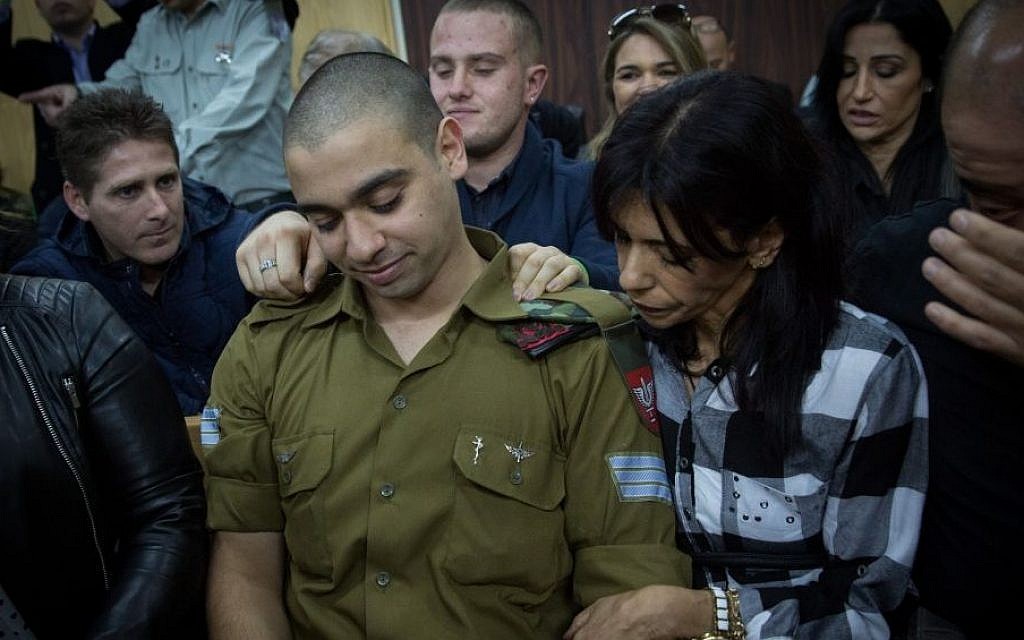 Elor Azaria, an Israeli soldier who shot a Palestinian terrorist in Hebron, sits in the courtroom before the announcement of the verdict in his trial at the Kirya military base in Tel Aviv on Wednesday, January 4, 2017 (Miriam Alster/Flash90)