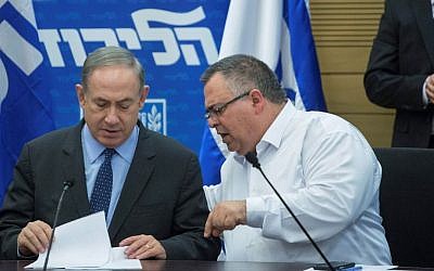 Prime Minister Benjamin Netanyahu (L) and Coalition Chairman David Bitan attend a Likud faction meeting in the Israeli parliament on January 30, 2017. (Miriam Alster/Flash90)