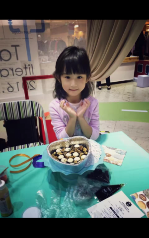 Child in China uses UgaUga's cake bake kit. Pictures were uploaded to UgaUga's blog by users of the kit (Courtesy