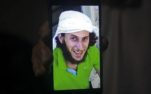 A relative shows a mobile phone photo of Fadi Qunbar, 28, outside his home in Jerusalem, Sunday, Jan. 8, 2017. Qunbar was identified as the terrorist who drove a truck into a group of Israeli soldiers, killing four and wounding 16 others (AP Photo/Mahmoud Illean)