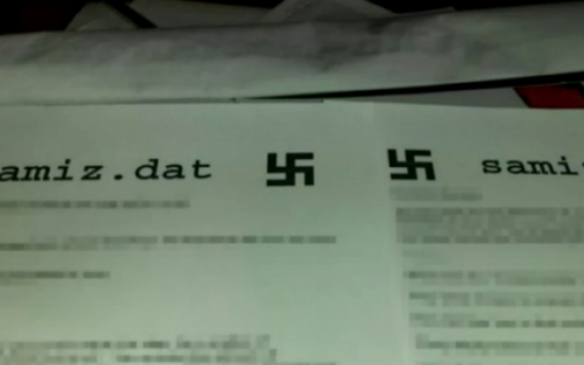 Fliers with swastikas that appeared on printers at the University of California, Berkeley, January 2017 (NBC screenshot)