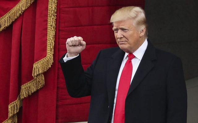 Then-President-elect Donald Trump pumps his fist as he arrives for the 58th Presidential Inauguration at the US Capitol in Washington, Friday, January 20, 2017. (AP Photo/Andrew Harnik)
