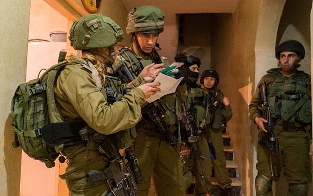 Illustrative: IDF troops make a late-night arrest in the West Bank on January 11, 2017. (IDF Spokesperson's Unit)