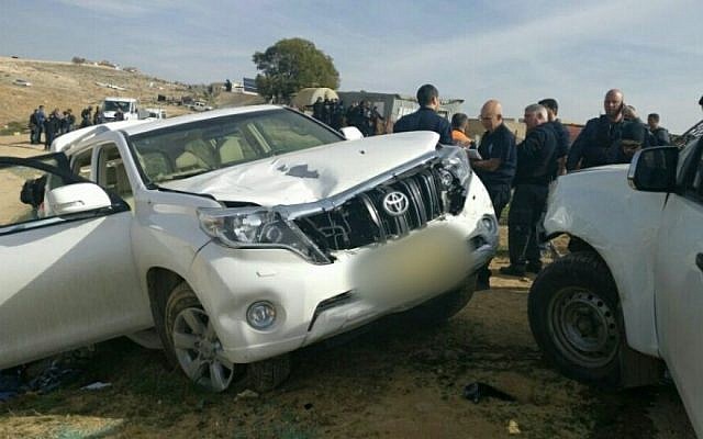 Israeli police stand next to a vehicle that crashed into police officers in the Bedouin village of Umm al-Hiran in the Negev desert, January 18, 2017. (Israel Police)