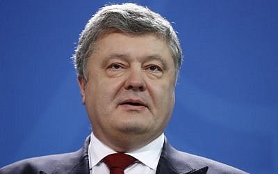 Ukraine's President Petro Poroshenko gives a joint press statement with the German Chancellor (not in picture) prior to their talks at the Chancellery in Berlin on January 30, 2017. (AFP PHOTO / Odd ANDERSEN)