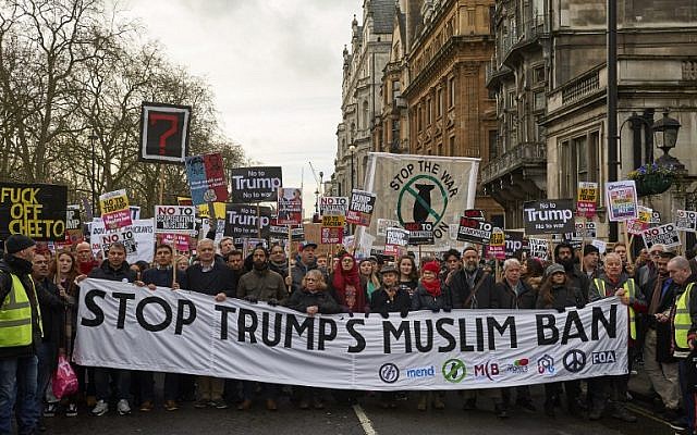 Demonstrators holding placards march in central London during a protest against US President Donald Trump, February 4, 2017. (AFP/NIKLAS HALLE'N)