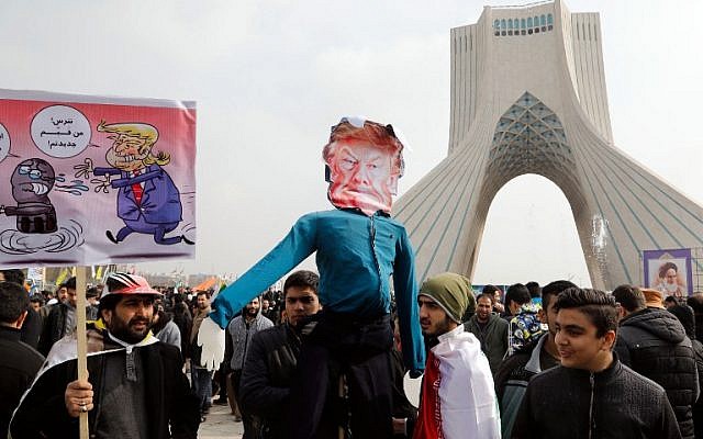 Iranians hold a dummy representing US President Donald Trump during a rally marking the anniversary of the 1979 Islamic revolution on February 10, 2017, in the capital Tehran. (Atta Kenare/AFP)