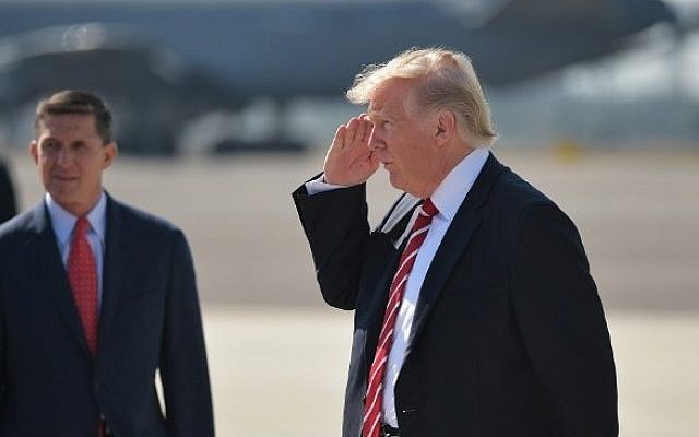 Then-National Security Adviser Michael Flynn (L) and US President Donald Trump (R) upon arrival at MacDill Air Force Base in Tampa, Florida, February 06, 2017. (AFP PHOTO / MANDEL NGAN)