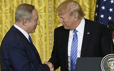 US President Donald Trump and Israeli Prime Minister Benjamin Netanyahu shake hands during a joint press conference at the White House in Washington, DC on February 15, 2017. (Saul Loeb/AFP)