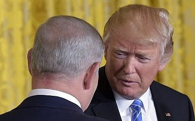 US President Donald Trump and Israel's Prime Minister Benjamin Netanyahu shake hands during a joint press conference in the East Room of the White House on February 15, 2017 in Washington, DC. (AFP/Mandel Ngan)
