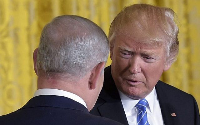 US President Donald Trump, right, Prime Minister Benjamin Netanyahu shake hands during a joint press conference in the East Room of the White House, in Washington, DC, February 15, 2017. (AFP PHOTO / MANDEL NGAN)