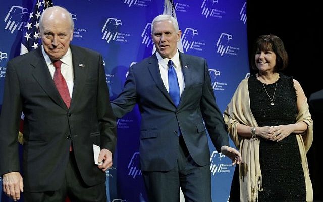 Vice President Mike Pence, center, takes the stage with his wife Karen Pence, right, after they were introduced by former Vice President Dick Cheney, left, at the Republican Jewish Coalition annual leadership meeting, Friday, Feb. 24, 2017, in Las Vegas. (AP Photo/John Locher)