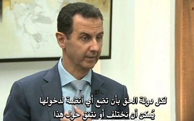 Screen capture of Syrian President Bashar Assad during an interview with media, February 2017. (Screen capture: R&U Videos/YouTube)
