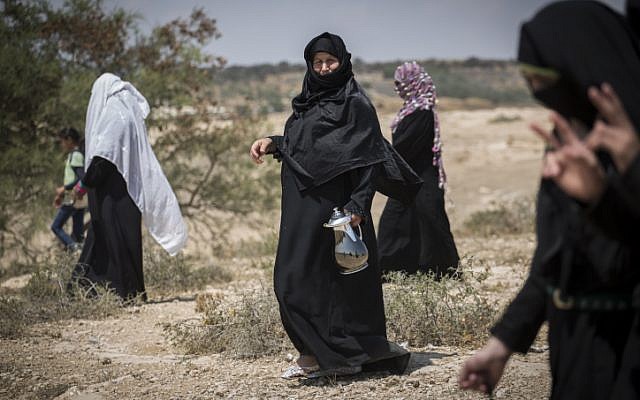 Residents of the Bedouin village of Umm al Hiran walk to their homes after attending a protest against the plan for the new Jewish town on the land on August 27, 2015. (Hadas Parush/Flash90)