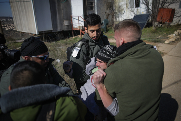 Israeli forces evacuate people from the Amona outpost in the West Bank, on the second day of the illegal settlement's evacuation, on February 2, 2017. (Yonatan Sindel/Flash90)