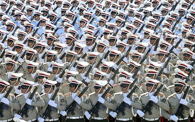 In this Sept. 21, 2016 file photo, Iranian armed forces members march in a military parade marking the 36th anniversary of Iraq's 1980 invasion of Iran, in front of the shrine of late revolutionary founder Ayatollah Khomeini, just outside Tehran, Iran. (AP Photo/Ebrahim Noroozi, File)