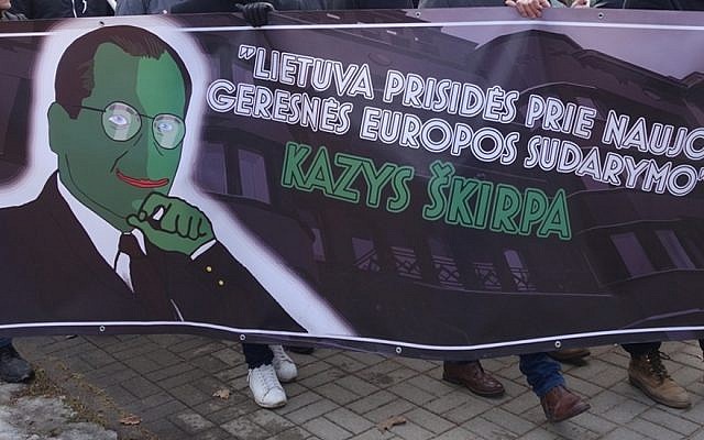 Nationalists carrying a picture merging Pepe the Frog and Kazys Skirpa during a march in Kaunas, Lithuania, on February 16, 2017. The banner reads: 'Lithuania will contribute to a new and better European order.' (Defending History via JTA)