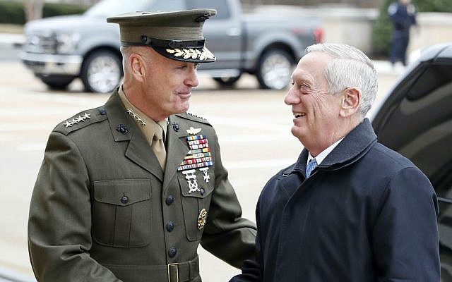 In this Jan. 21, 2107 file photo, US Joint Chiefs Chairman Gen. Joseph Dunford, left, greets Defense Secretary James Mattis at the Pentagon. (AP Photo/Alex Brandon, File)