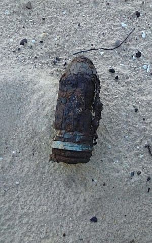 An old explosive shell found in the sand dunes at the Nitzanim Nature Reserve in southern Israel. (Israel Police Spokesperson) 