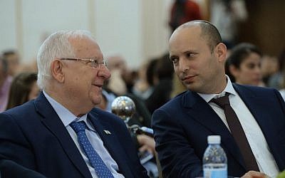 President Reuven Rivlin, left, and Education Minister Naftali Bennett, right, at a conference for regional education department heads in Jerusalem on February 28, 2017. (Mark Neyman/GPO)