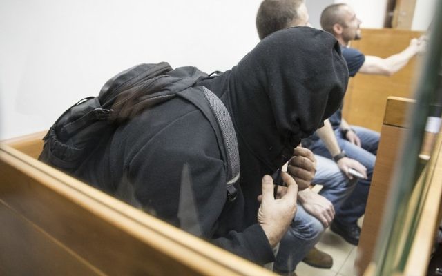 The father of American-Israeli Jewish teenager, accused of making dozens of anti-Semitic bomb threats in the United States and elsewhere, sits in the Israeli Justice court in Rishon Lezion on March 23, 2017. (AFP/JACK GUEZ)