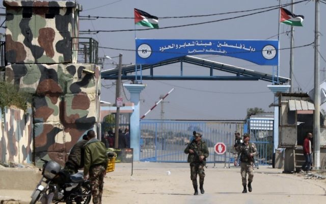 Hamas security forces stand guard at Erez border crossing into Israel, in Beit Hanun, in the northern Gaza Strip on March 26, 2017, after it was shut by the Islamist movement after blaming the Jewish state for the assassination of one of its officials in the Palestinian enclave. (AFP/MAHMUD HAMS)