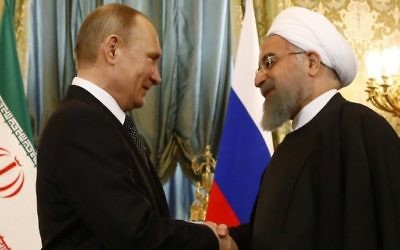 Russian President Vladimir Putin (L) shakes hands with his Iranian counterpart Hassan Rouhani during their meeting at the Kremlin in Moscow on March 28, 2017. (Sergei Karpukhin/AFP) 